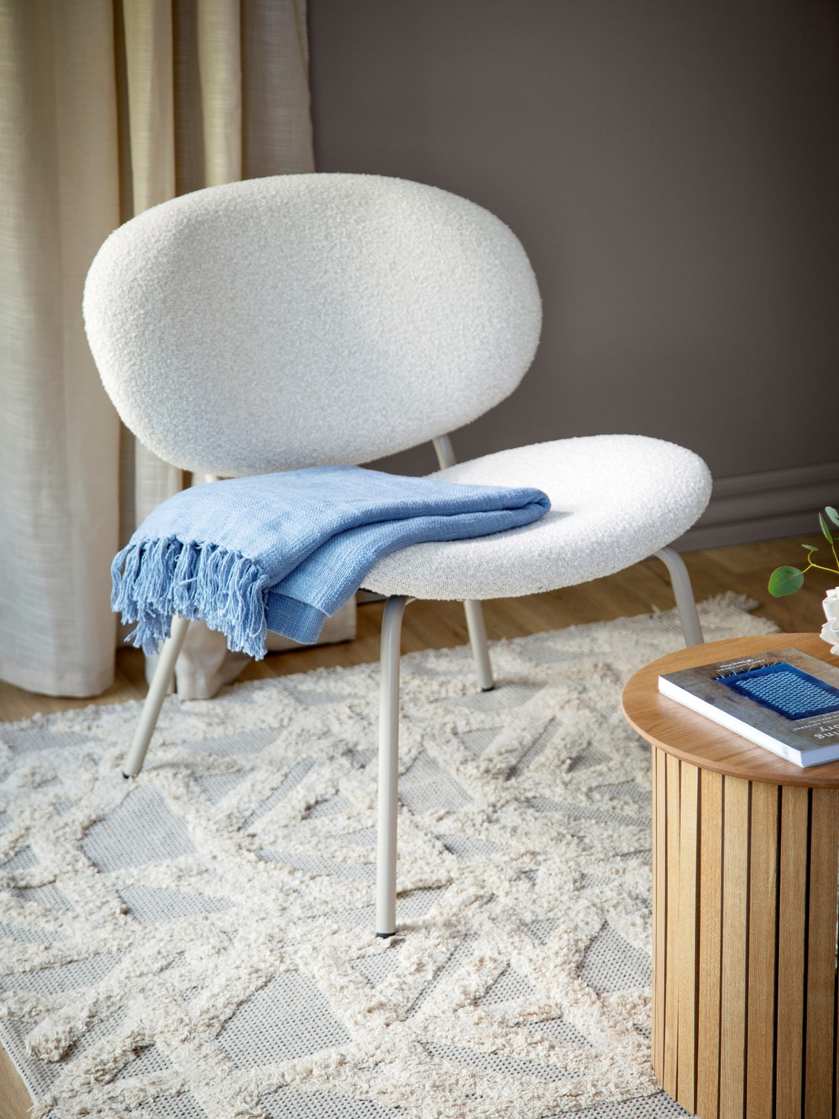 Lounge chair with bouclé fabric