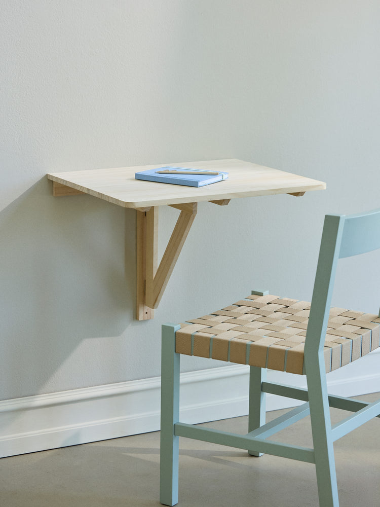 Foldable wall-mounted table
