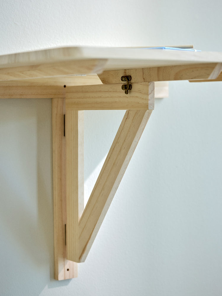 Foldable wall-mounted table