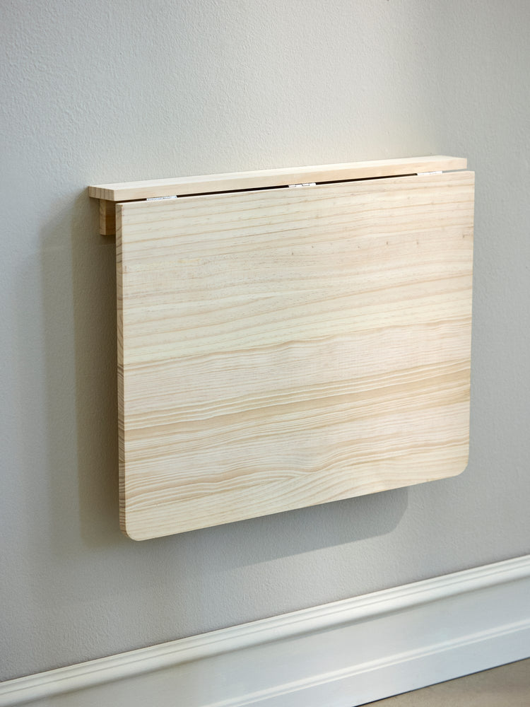 Foldable wall-mounted table