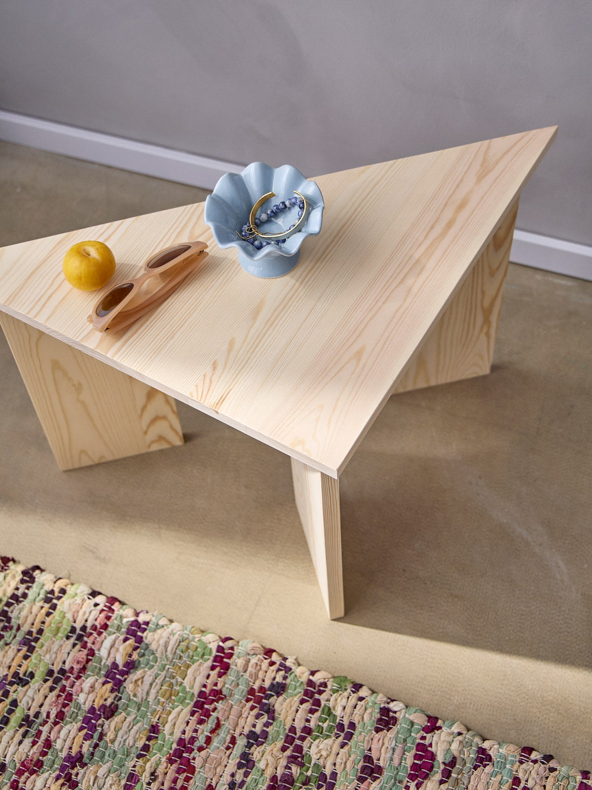 Triangular pinewood side table