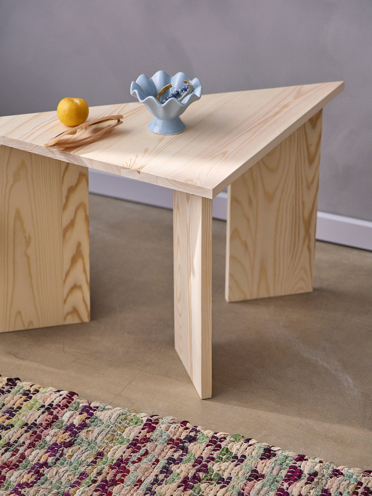 Triangular pinewood side table