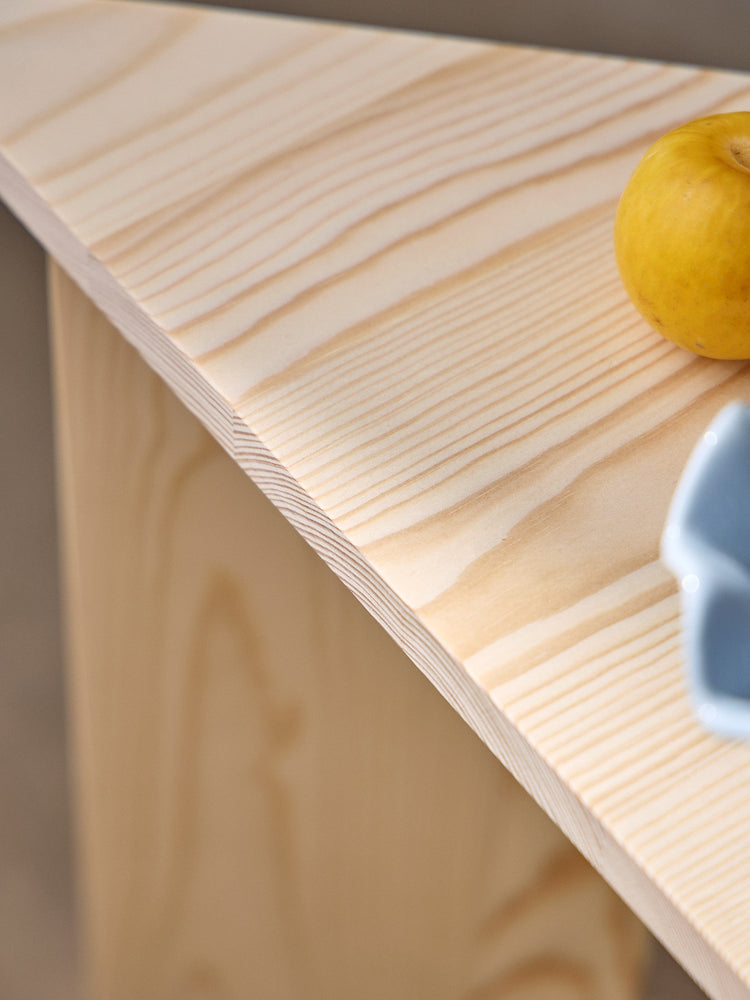 Triangular pinewood side table