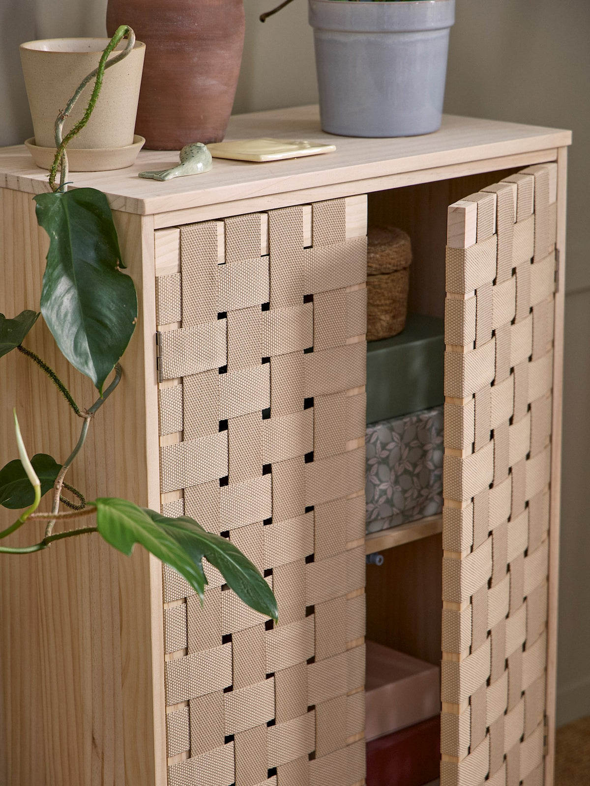 Cabinet with woven design