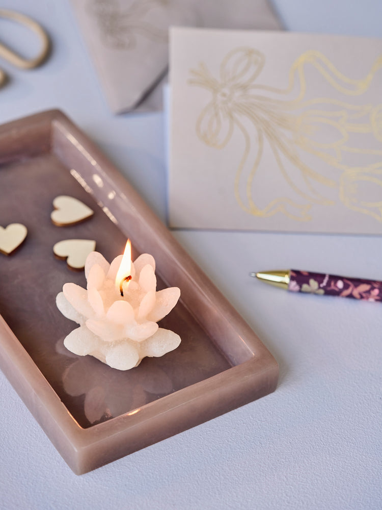 Flower-shaped candle