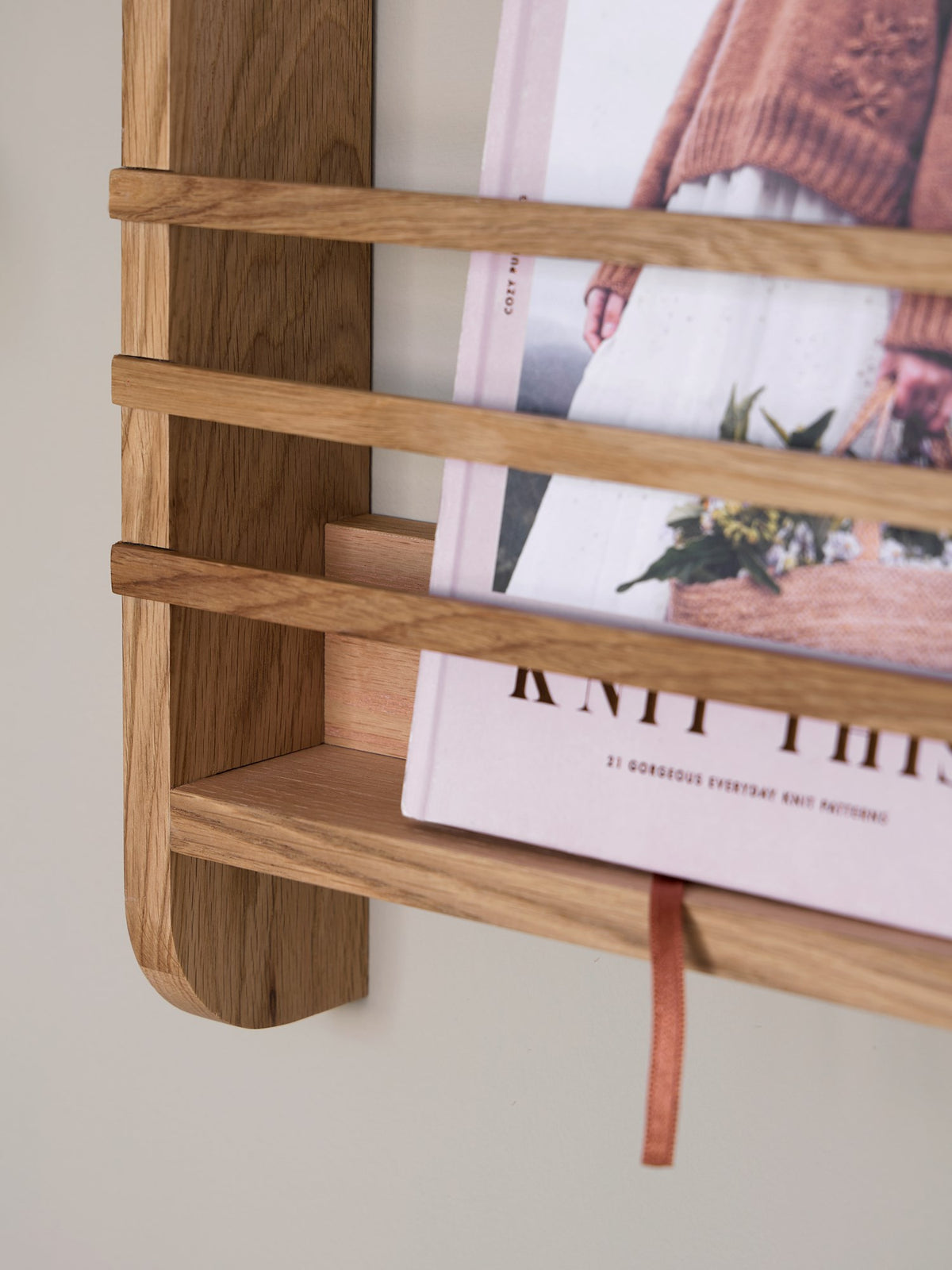 Wall-mounted magazine holder