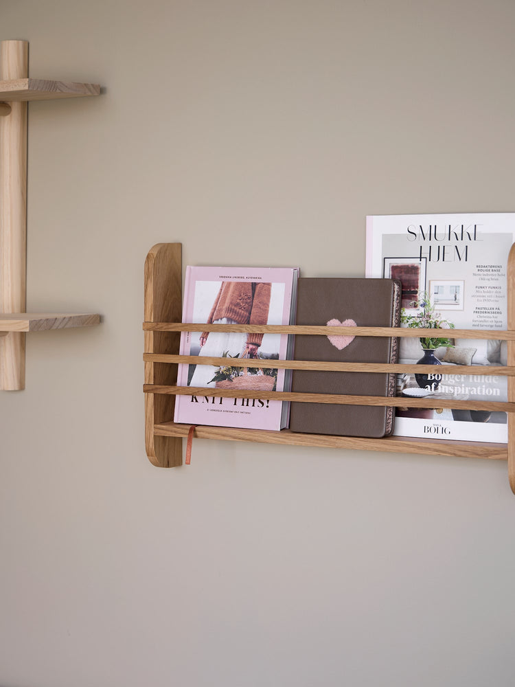 Wall-mounted magazine holder