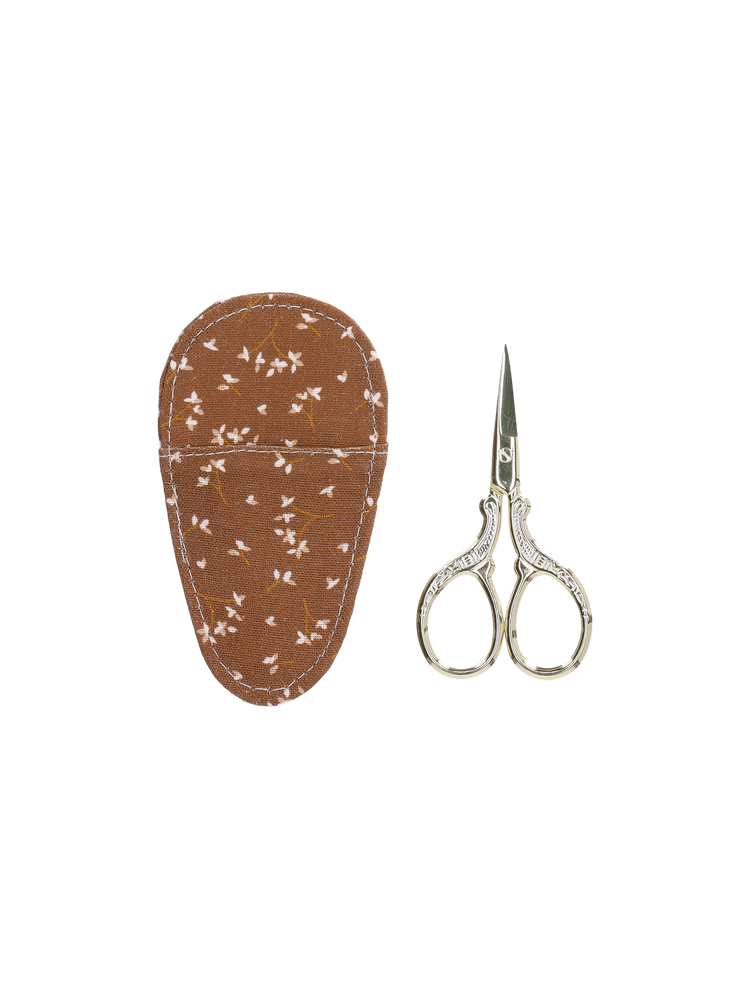 Scissors in textile cover