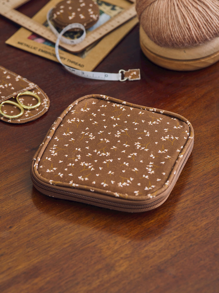 Sewing kit in textile cover