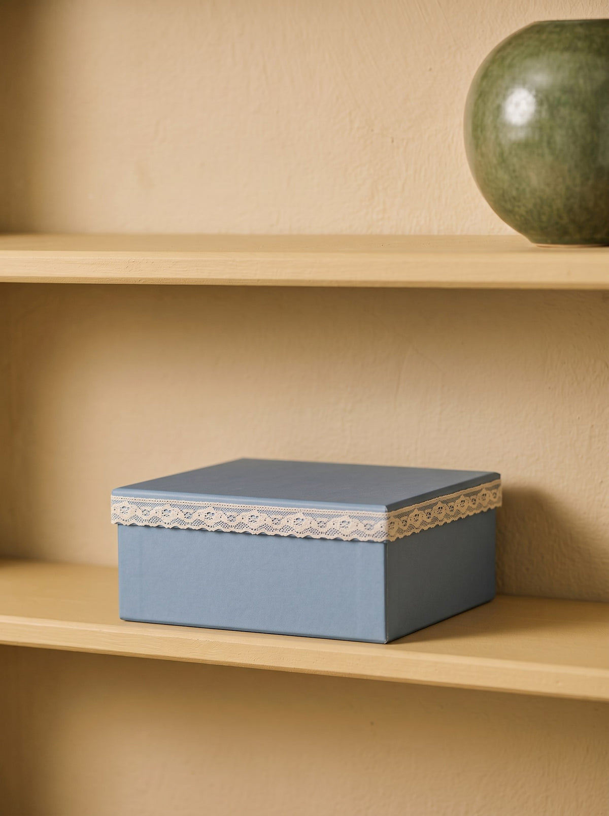 Storage box with lace detail
