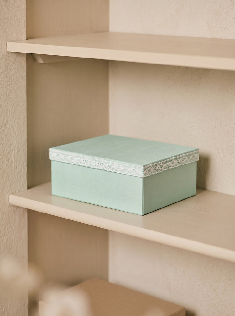 Storage box with lace detail