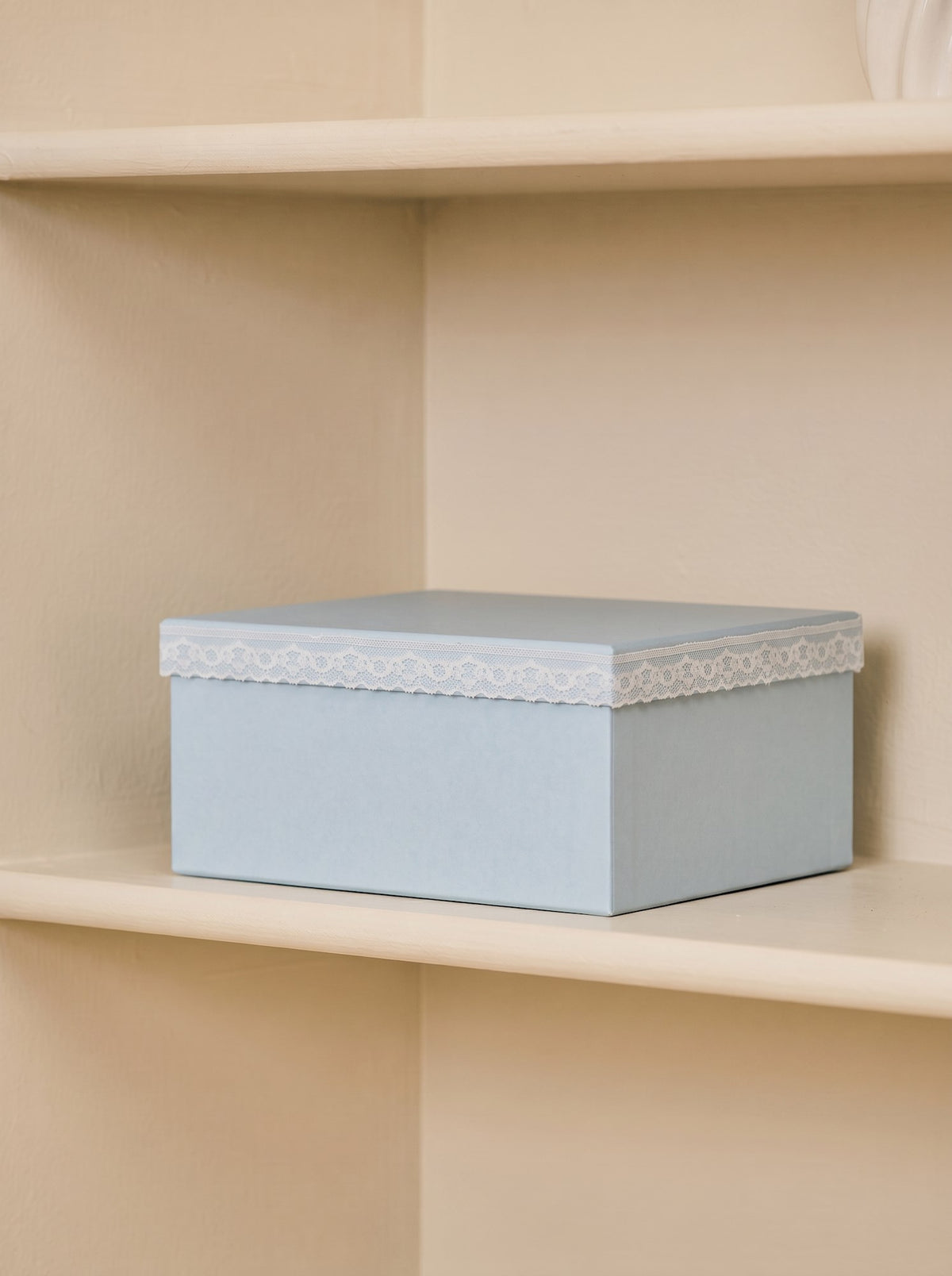 Storage box with lace detail