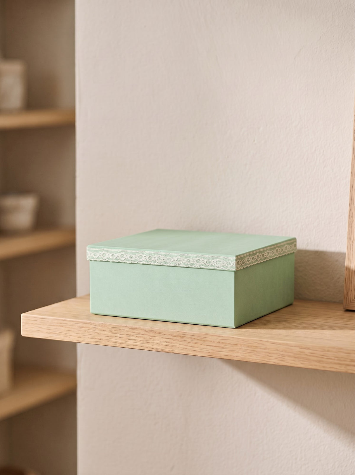 Storage box with lace detail