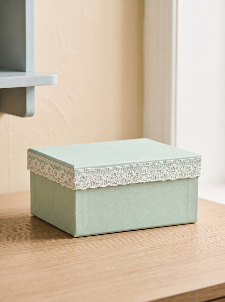 Storage box with lace detail