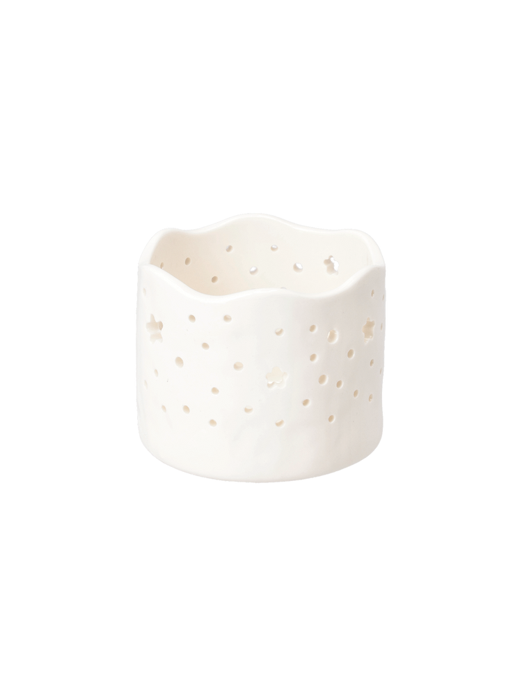 Tealight holder with cutouts