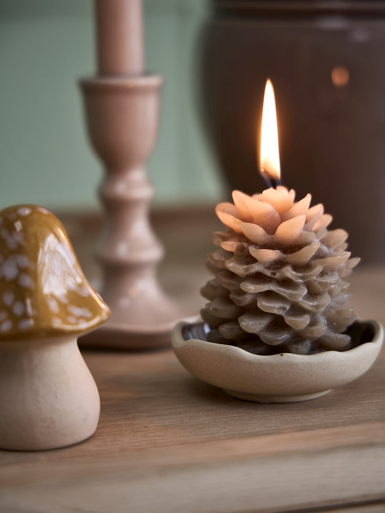 Pine cone-shaped candle