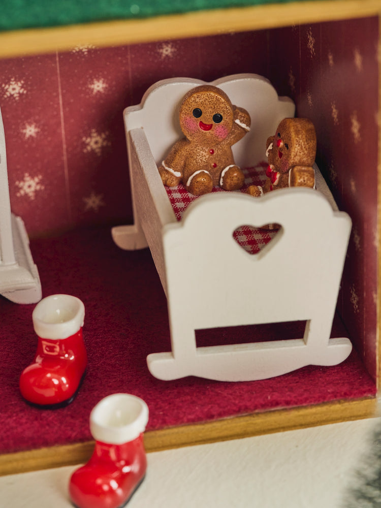 Miniature cradle with blanket