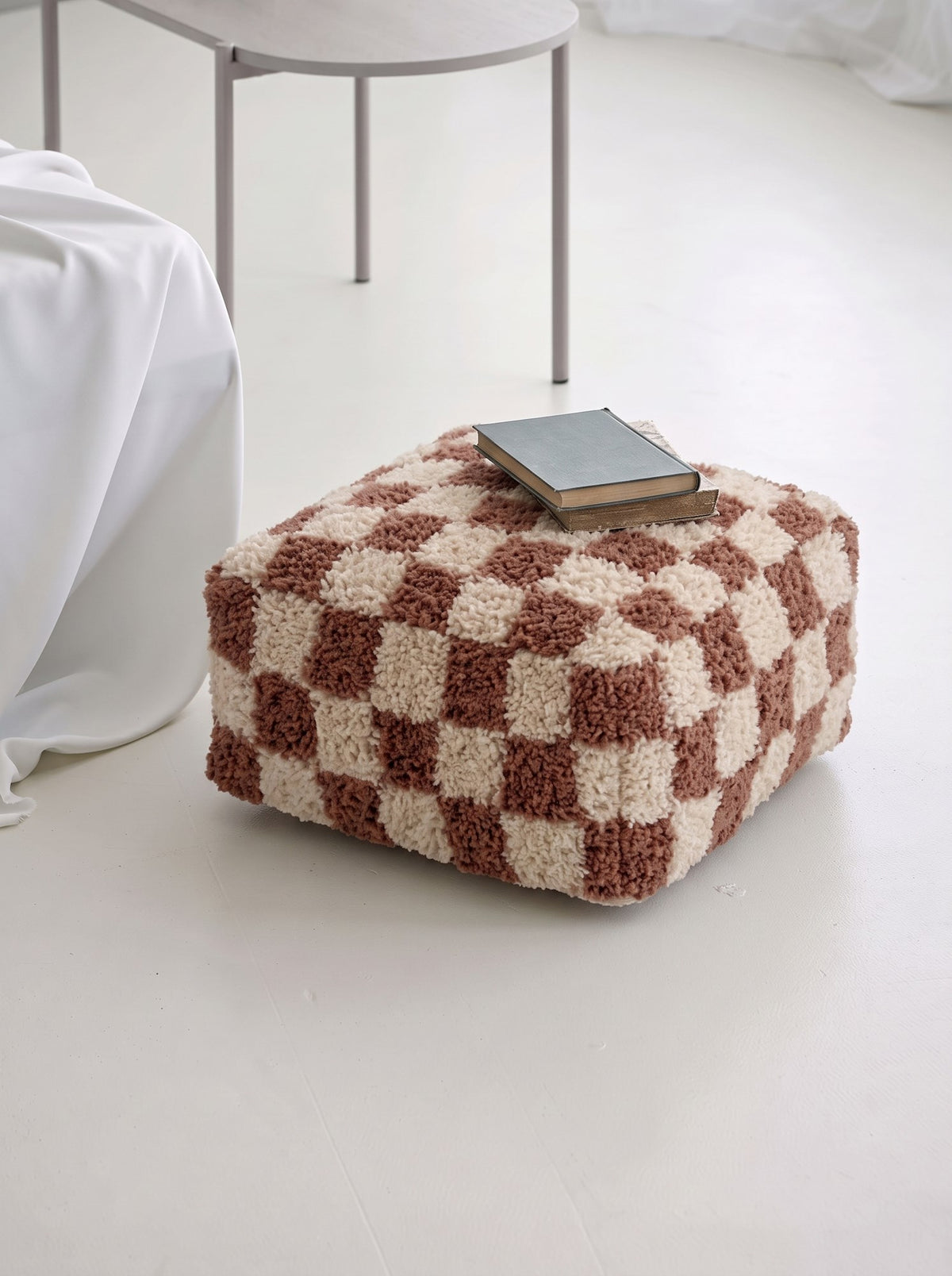 Checkered pouffe