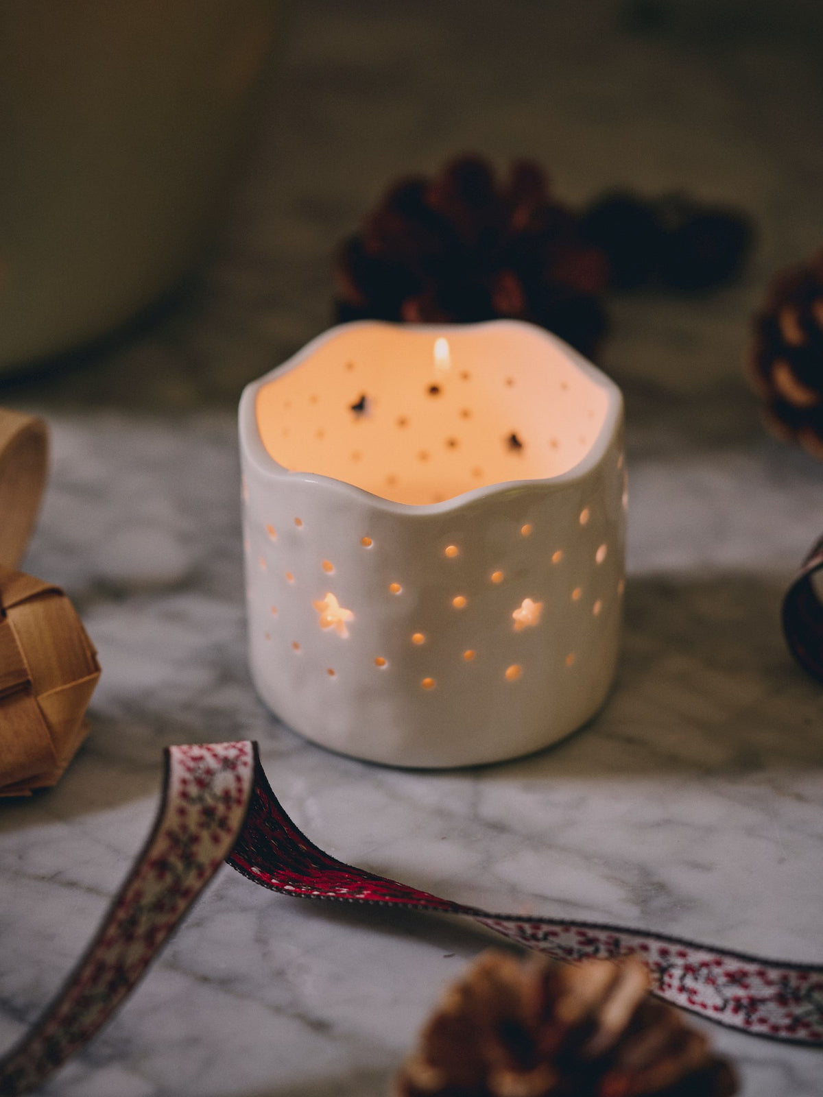 Tealight holder with cutouts