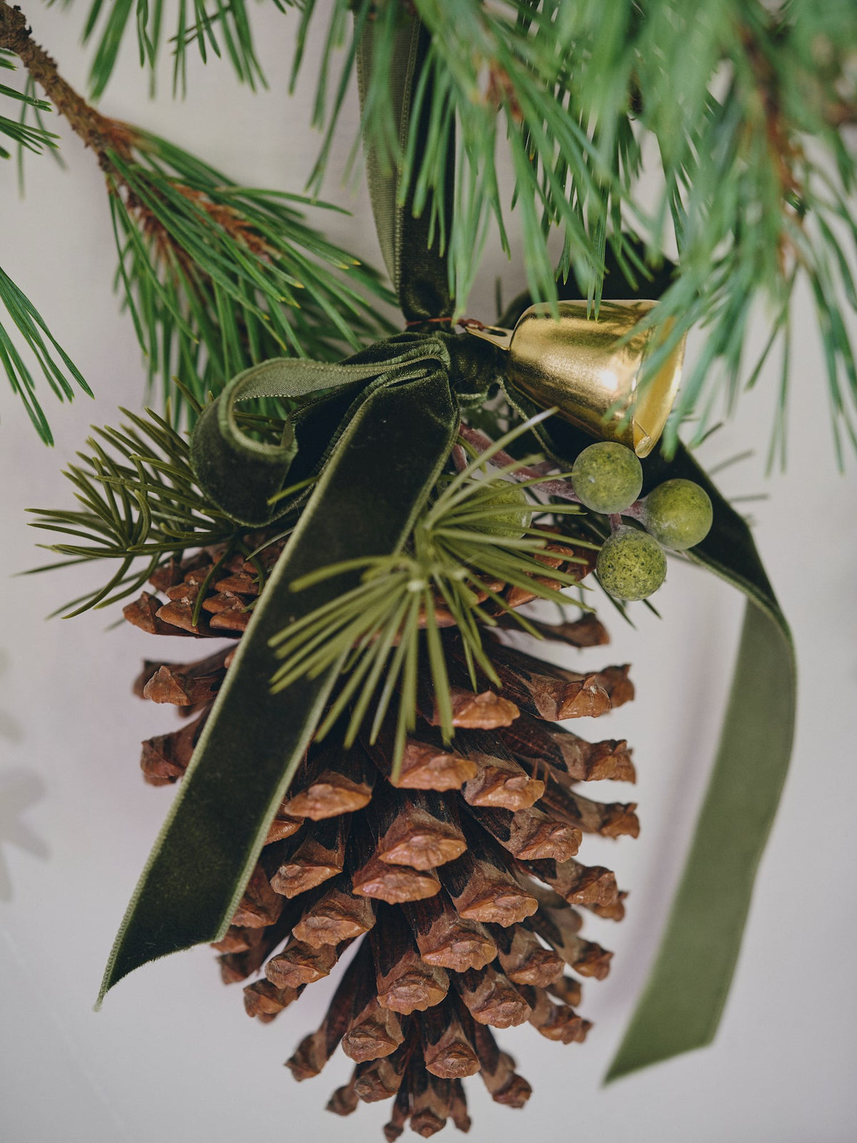 Pine cone with bell