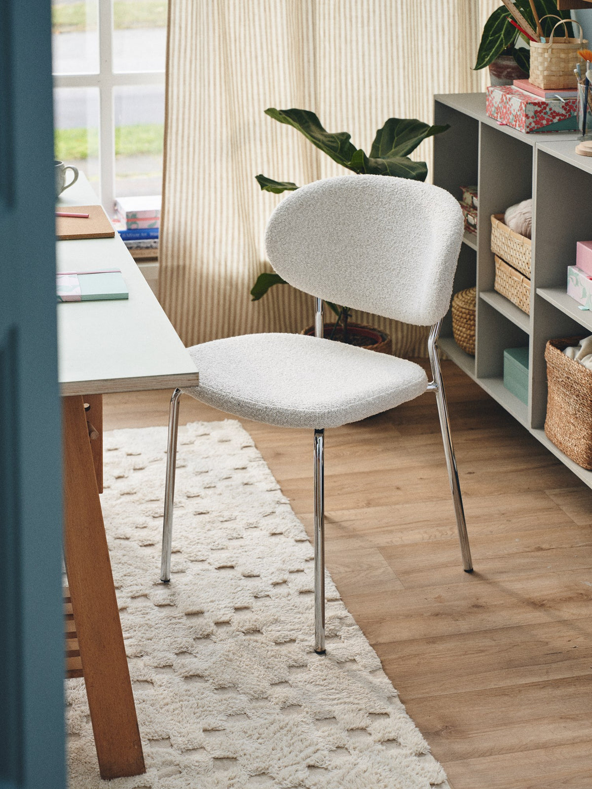 JOY Bouclé dining chair with chrome-look frame